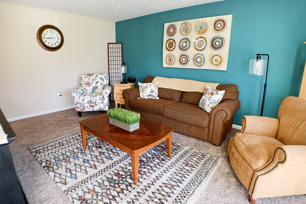 a living room with a couch and a coffee table at Timber Ridge Apartments, Cincinnati