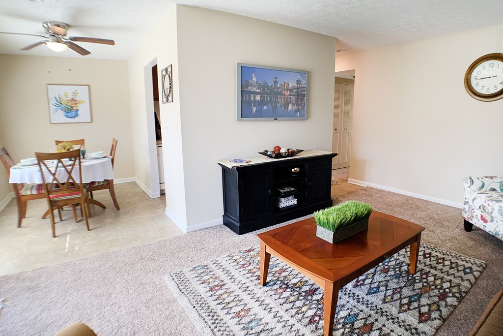 a living room with a coffee table and a dining room table at Timber Ridge Apartments, Cincinnati, OH, 45241