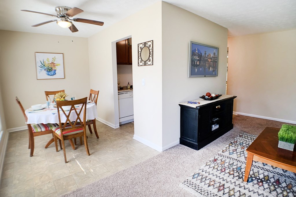 an open living room and dining room with a table and chairs at Timber Ridge Apartments, Cincinnati, Ohio