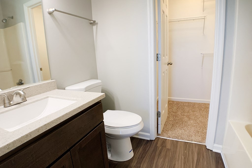 a bathroom with a toilet and a sink and a shower  at Aberdine Place, Georgetown, KY
