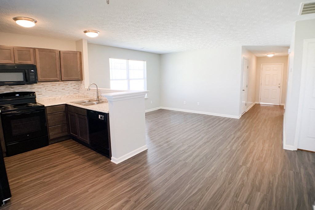 an empty kitchen and living room with wood flooring and  at Aberdine Place, Kentucky, 40324