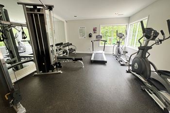 a gym with cardio machines and weights on the floor at The Vinings Apartments, Cincinnati, 45245