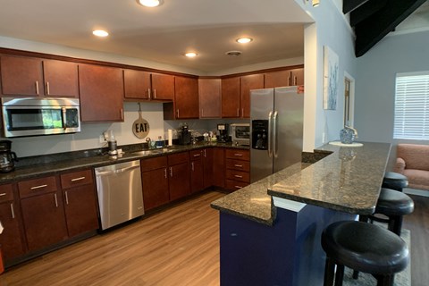 a kitchen with stainless steel appliances and a granite counter top
