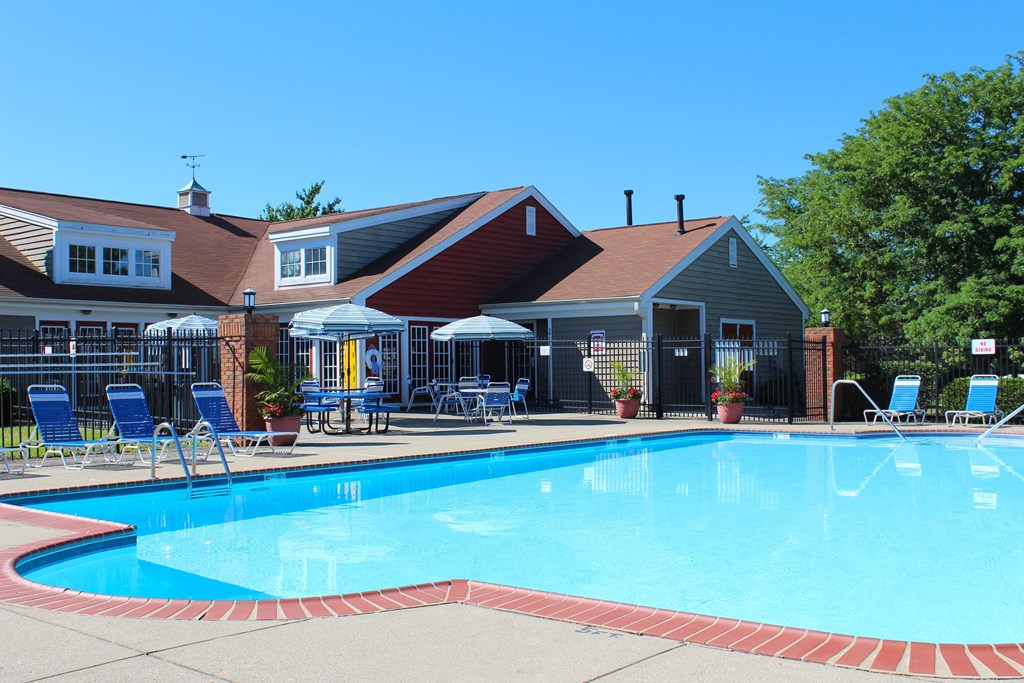 a swimming pool in front of a house with a resort style pool at Steeplechase Apartments, Loveland, 45140