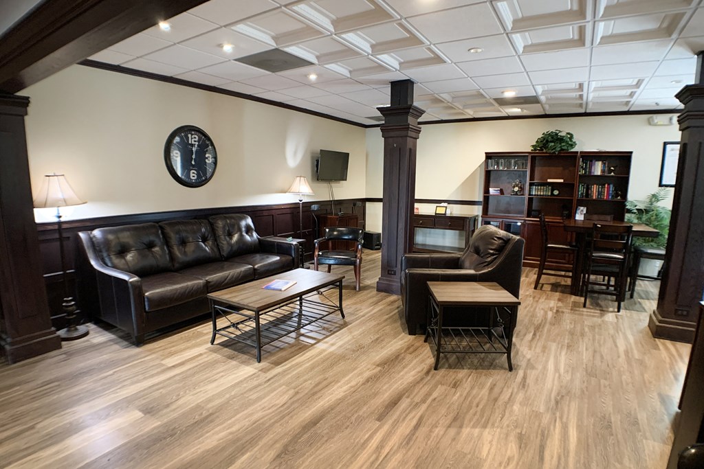 a living room with couches and chairs and a table  at Knobs Pointe Apartments, New Albany, Indiana
