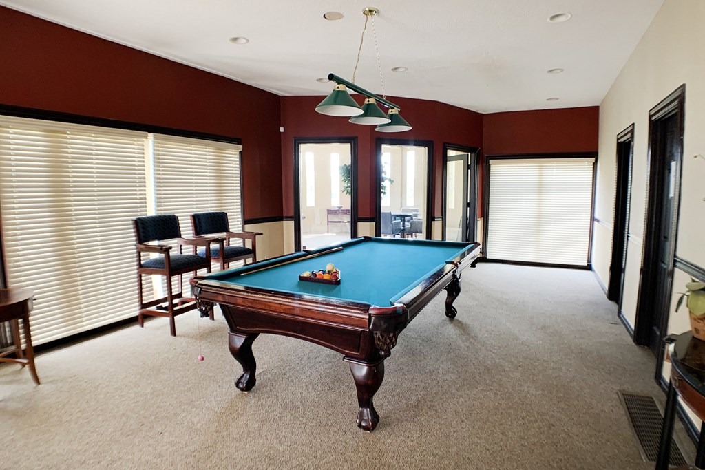 a pool table in the middle of a living room  at Knobs Pointe Apartments, New Albany, IN, 47150