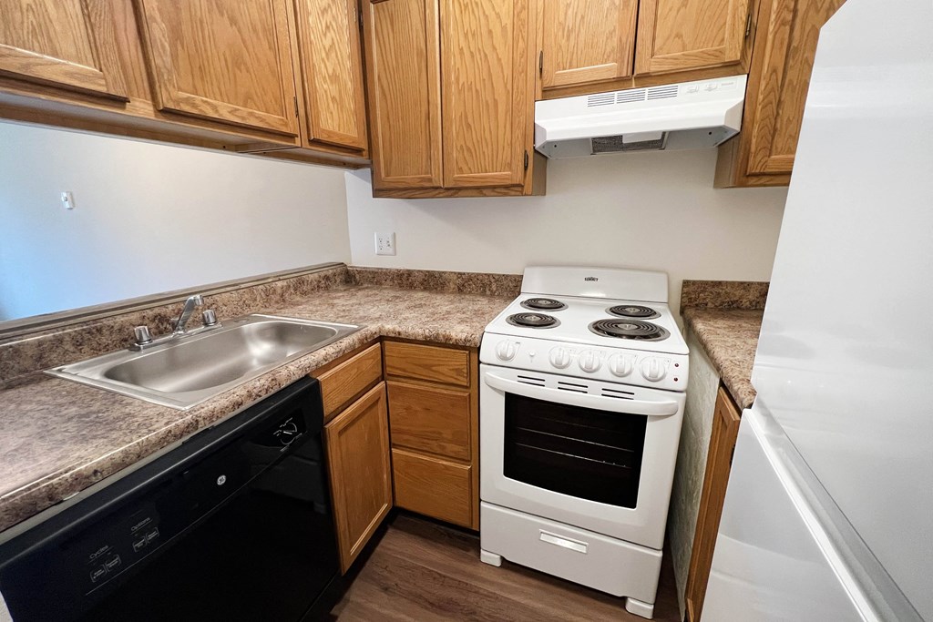 Kitchen With White Cabinetry And Appliances  at Concord Woods Apartments, Ohio