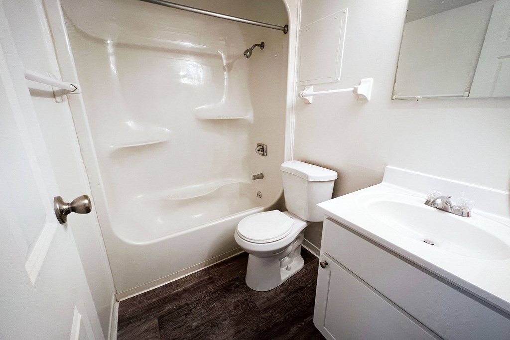 a bathroom with a white sink and toilet next to a white bathtub at Indian Lookout Apartments, Cincinnati