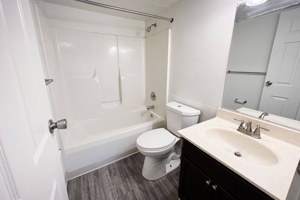 a bathroom with a bathtub toilet and sink at Quail Meadow Apartments, Cincinnati, OH