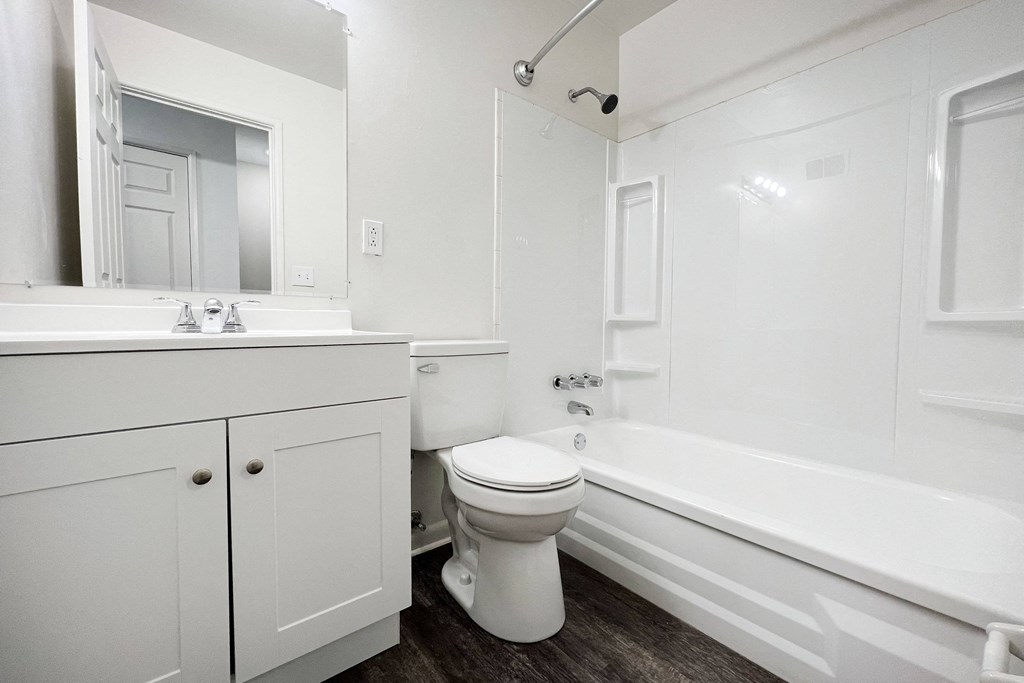 a bathroom with a toilet sink and bathtub at Wentworth Estates Apartments, Florence, KY