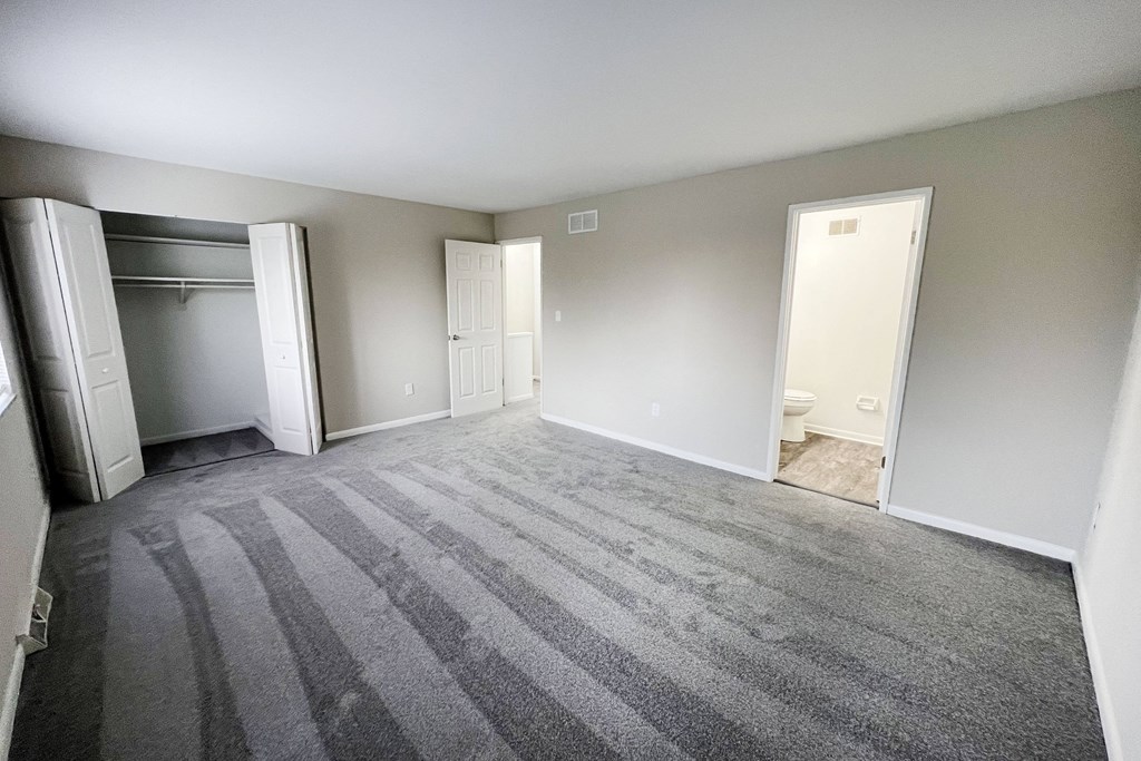 an empty bedroom with a closet and a toilet at Wentworth Estates Apartments, Florence, KY