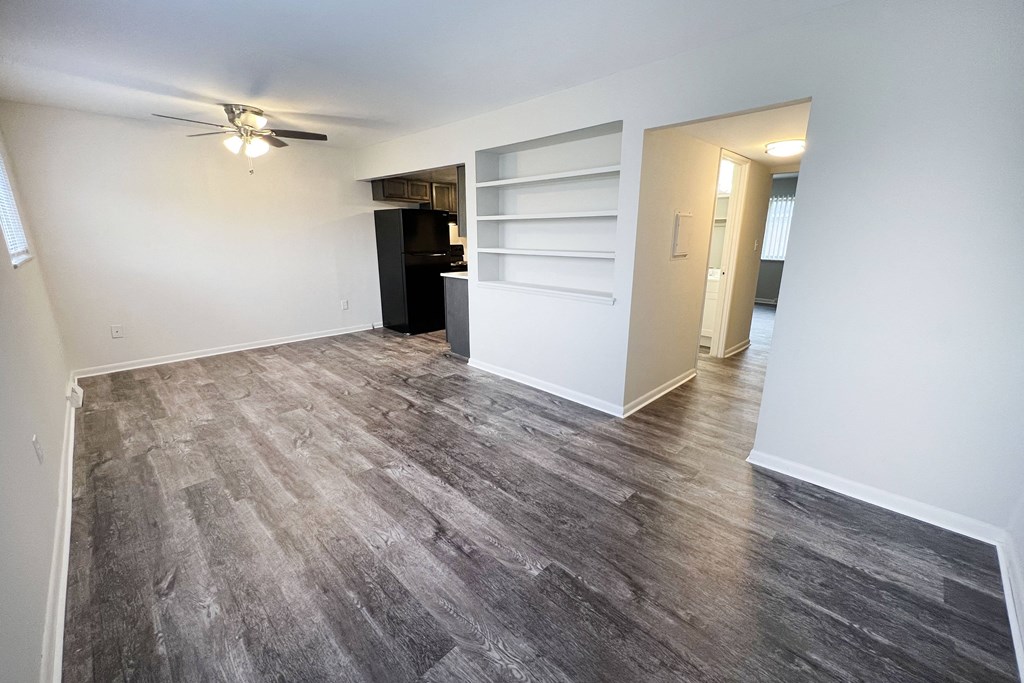 a bedroom with hardwood floors and white walls at Wentworth Estates Apartments, Florence, KY