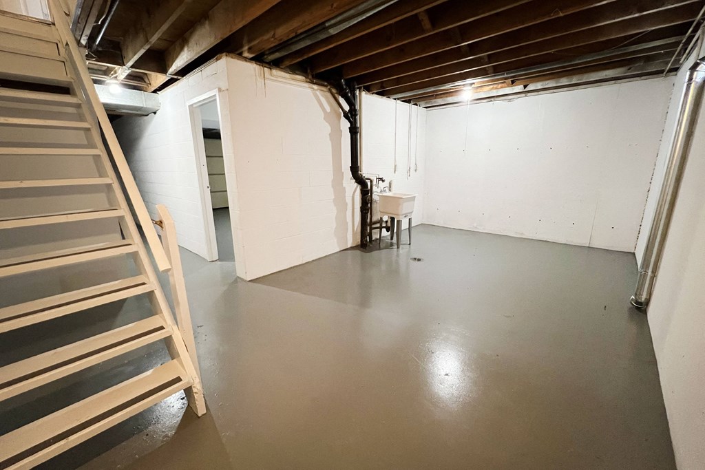 a large room with white walls and a gray floor at Wentworth Estates Apartments, Florence, KY