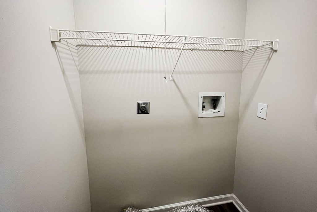 a closet in a bedroom with white walls and a white ceiling  at Woodhills Apartments, West Carrollton, OH, 45449