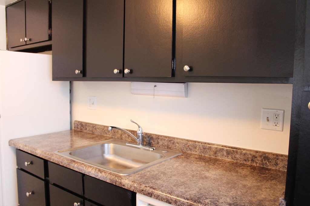 Dark wooden cabinets and counter table at Miamisburg by the Mall, Miamisburg, 45342