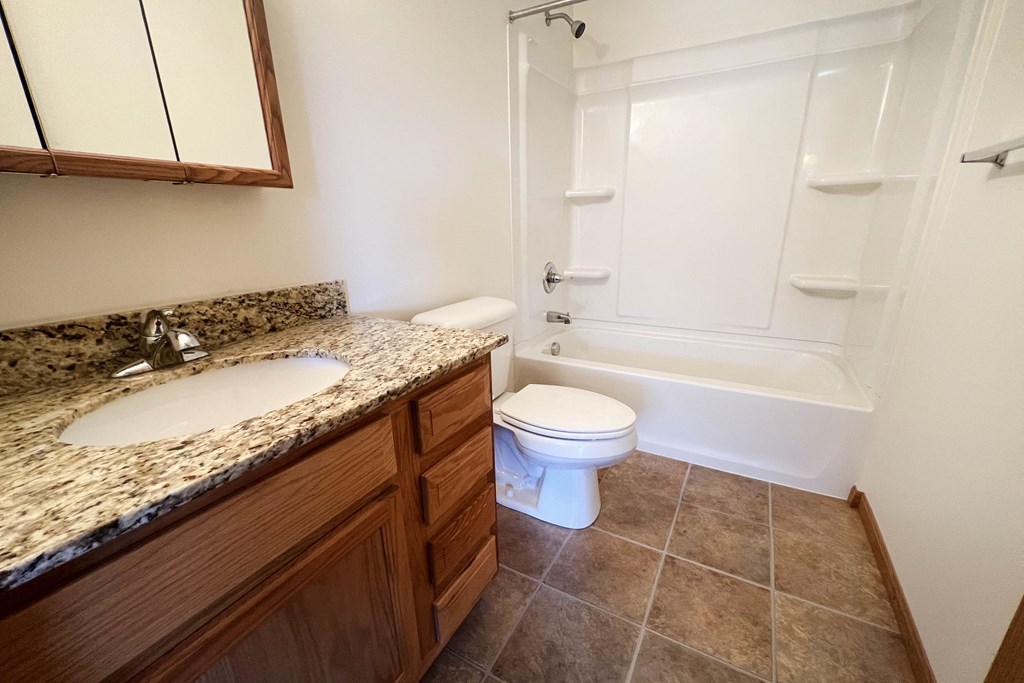 a bathroom with a toilet sink and bathtub  at The Overlook at Ft. Thomas, Ft. Thomas, KY
