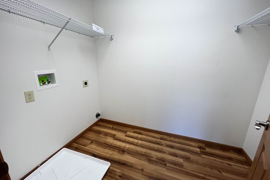 a bathroom with white walls and a wooden floor  at The Overlook at Ft. Thomas, Ft. Thomas, 41075