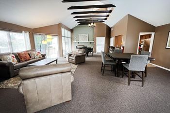 a living room and dining room with couches and a table at Walnut Creek Townhomes, Cincinnati, OH