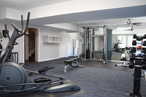a gym with weights and cardio equipment in a home gym  at Timber Ridge Apartments, Cincinnati, Ohio