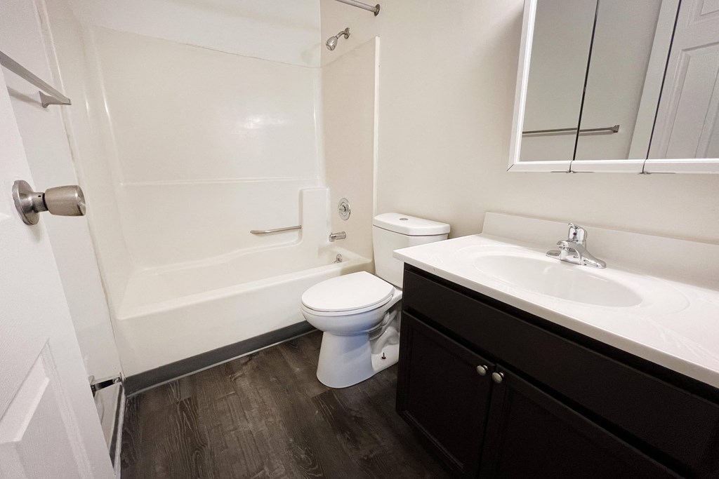 a bathroom with a toilet sink and bathtub at Quail Meadow Apartments, Cincinnati, 45240