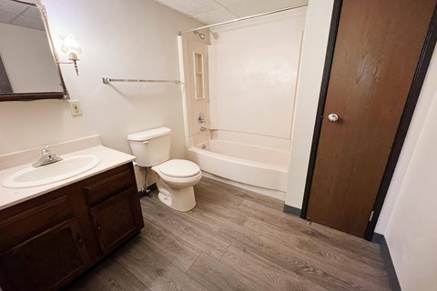 a bathroom with a toilet sink and bathtub  at Devou Village, Ft. Wright, KY, 41011