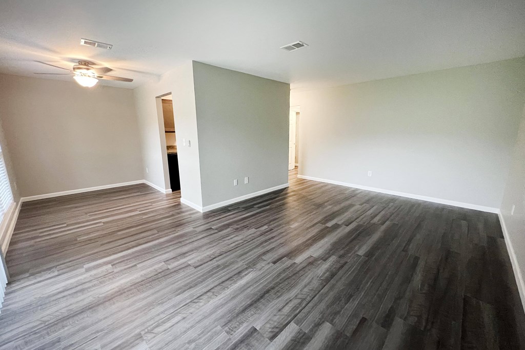 a bedroom with hardwood floors and a ceiling fan  at Timber Ridge Apartments, Ohio