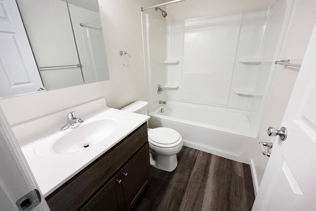 a bathroom with a sink toilet and bathtub  at Timber Ridge Apartments, Ohio