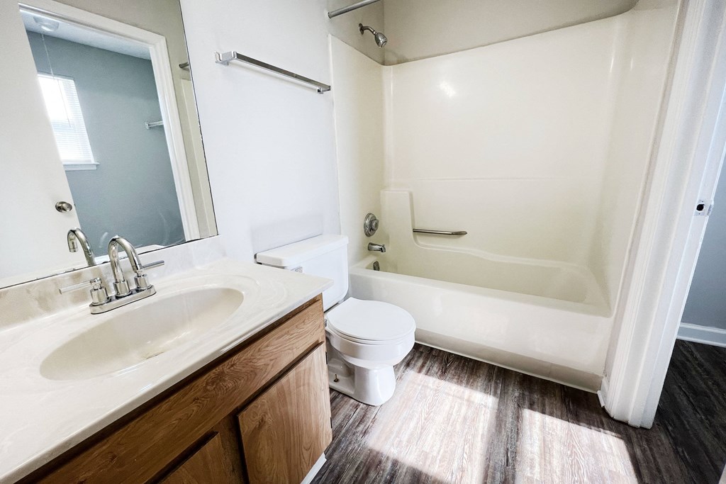 a bathroom with a toilet sink and bathtub at 450 on Keeneland, Richmond