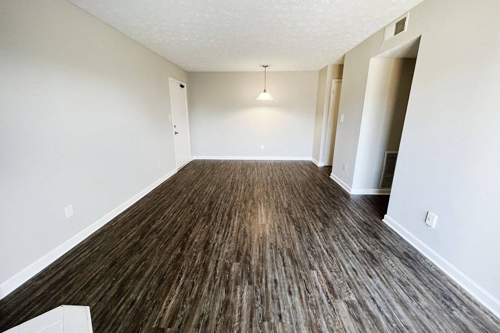 a living room with a hardwood floor and white walls at 450 on Keeneland, Kentucky, 40475