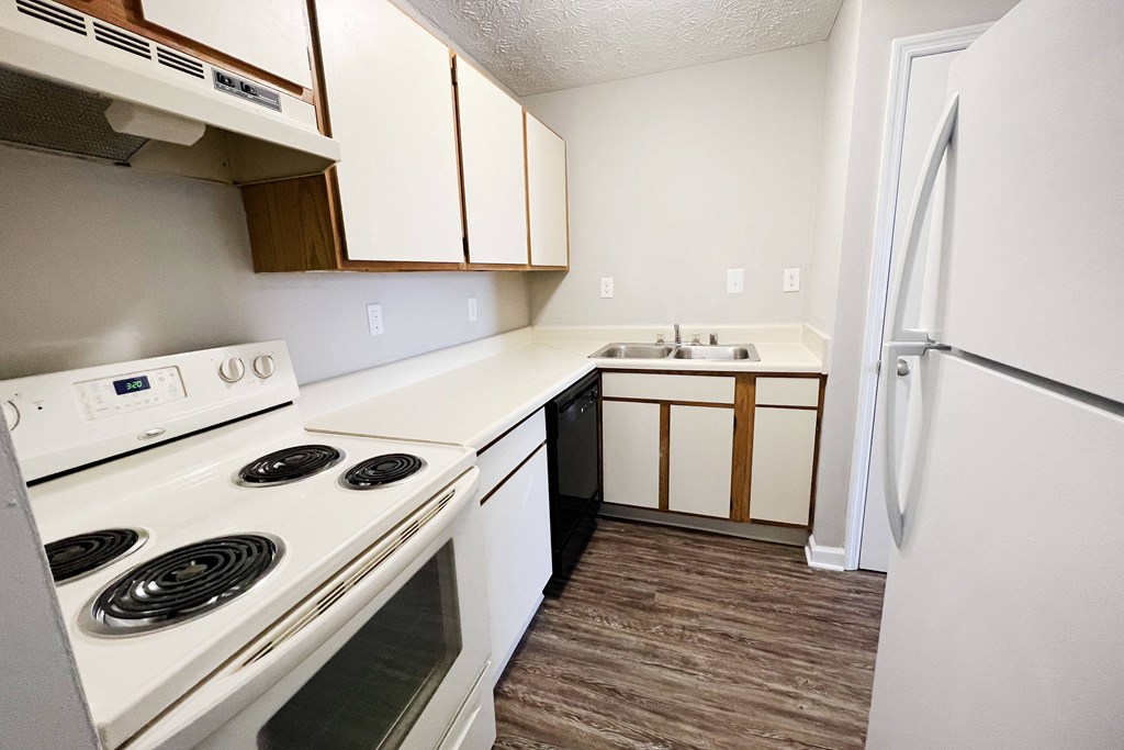 a kitchen with white appliances and white cabinets at 450 on Keeneland, Richmond, 40475