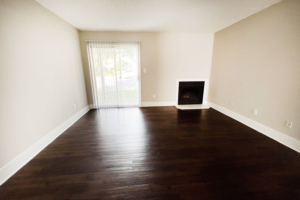 a bedroom with hardwood flooring and a fireplace at 450 on Keeneland, Kentucky, 40475