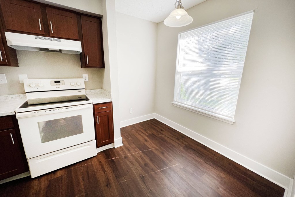 a kitchen with white appliances and wood flooring at 450 on Keeneland, Richmond, 40475