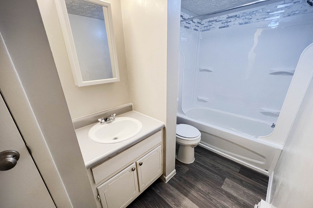 an empty bathroom with a sink toilet and shower at Oakwood Apartments, Florence, 41042
