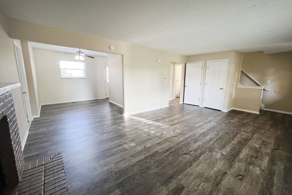 an empty living room with a hard wood floor  at The Villas at Kingswood, West Chester, OH