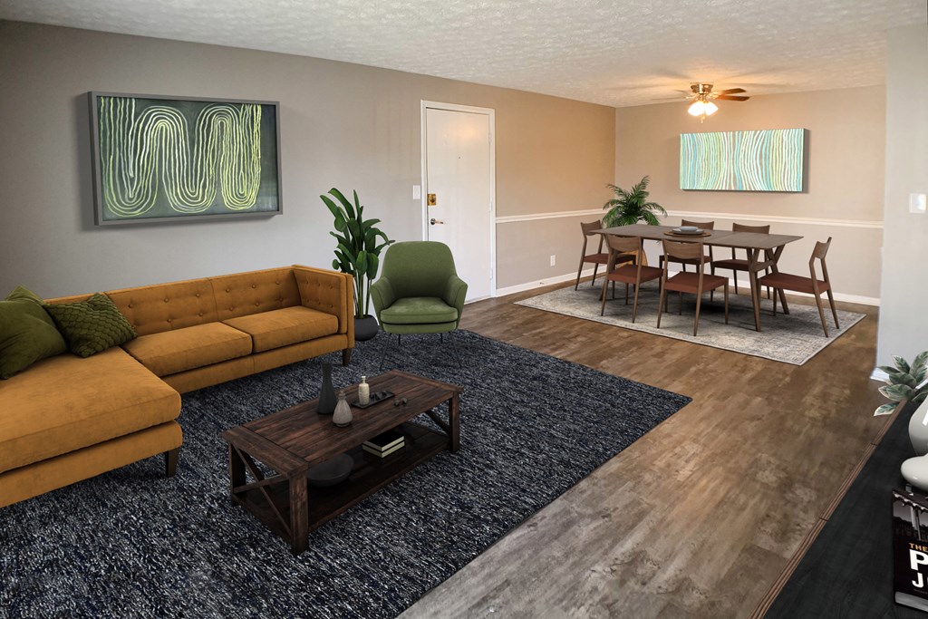 a living room and dining room with a couch and a table  at Knobs Pointe Apartments, New Albany, IN, 47150