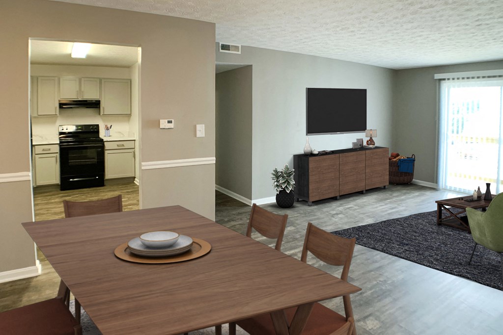 a dining room and living room with a table and a television  at Knobs Pointe Apartments, New Albany, 47150