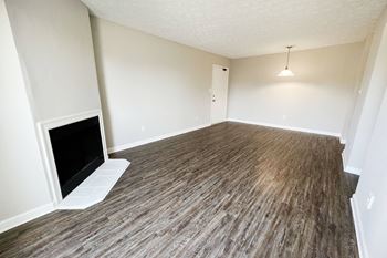 an empty living room with a fireplace at 450 on Keeneland, Richmond