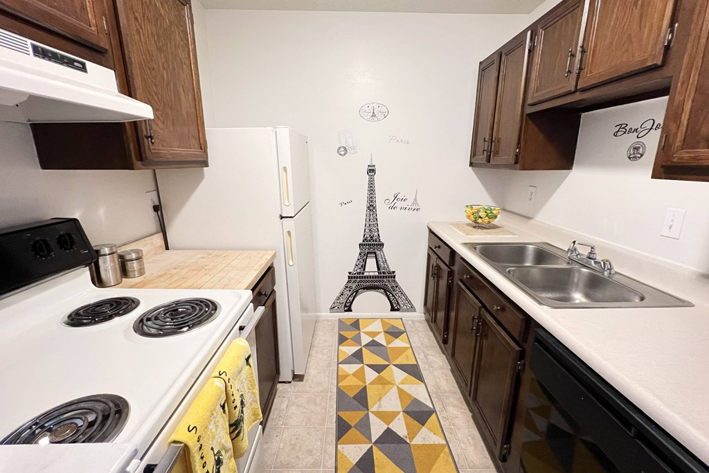a kitchen with a eiffel tower on the floor at Revere Village Apartments, Centerville