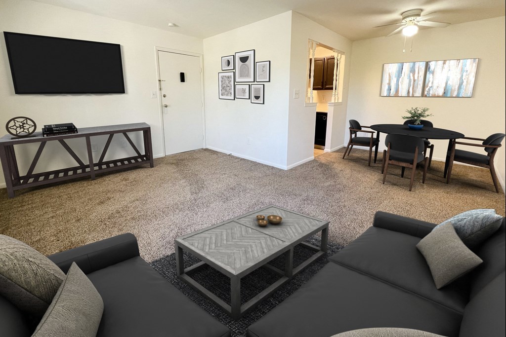 a living room with a couch and a table and a televisionat Revere Village Apartments, Centerville, Ohio