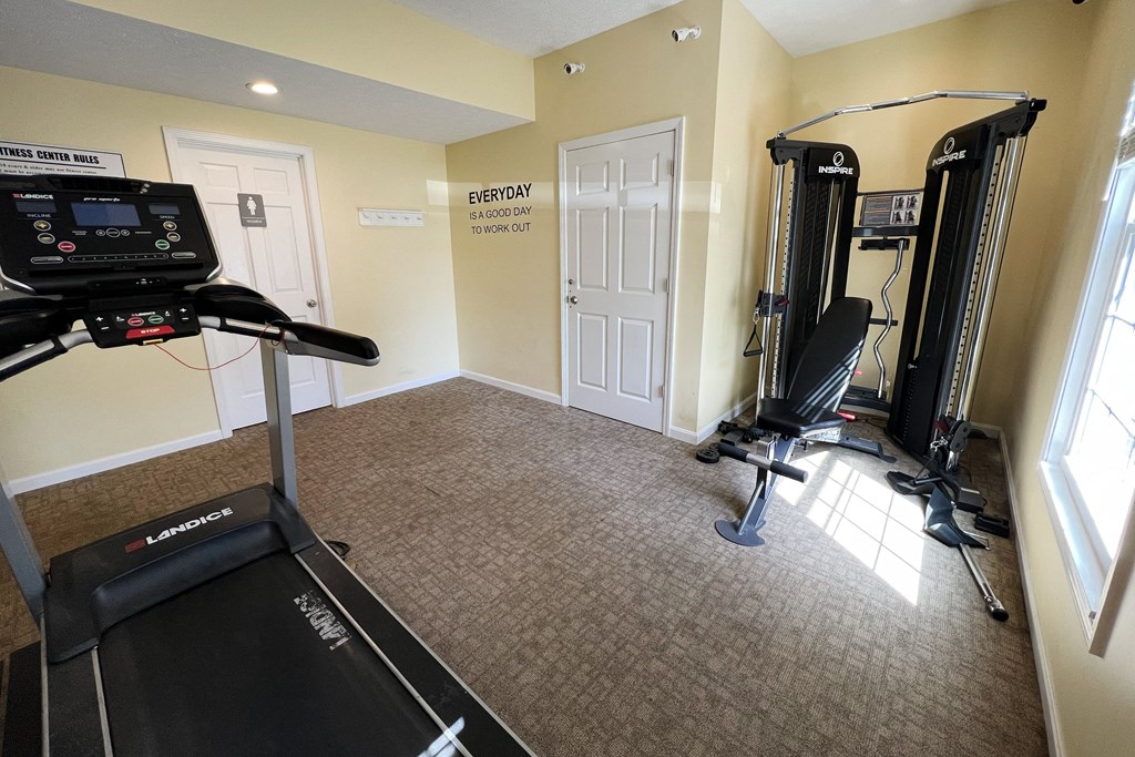 a home gym with a treadmill and exercise equipmentat Revere Village Apartments, Centerville, 45458