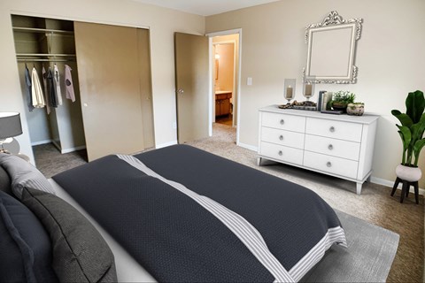 Bedroom with cozy bed with cabinets at Sharondale Woods Apartments, Ohio