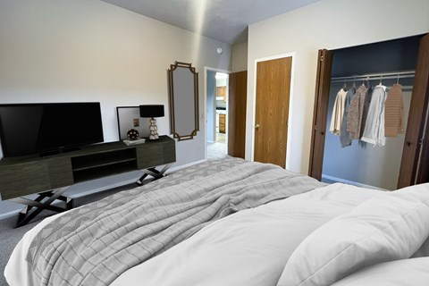A bedroom with a large bed and a television.