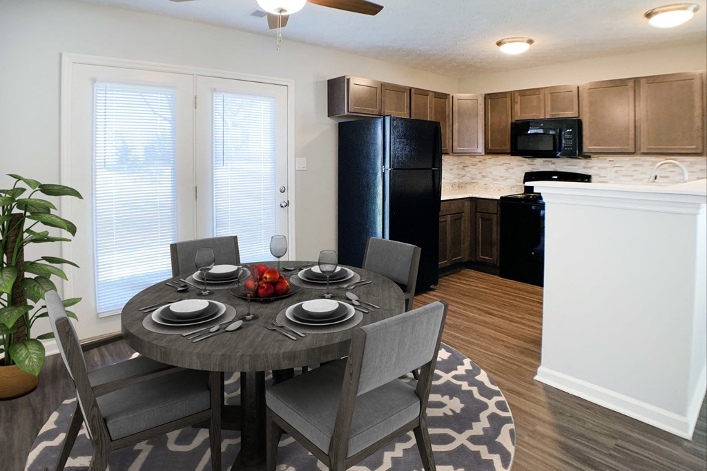 a kitchen and dining room with a table and chairs  at Aberdine Place, Georgetown, 40324