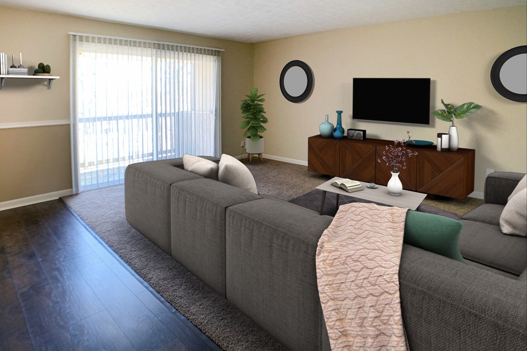 a living room with a gray couch and a television  at Timber Ridge Apartments, Cincinnati, OH, 45241