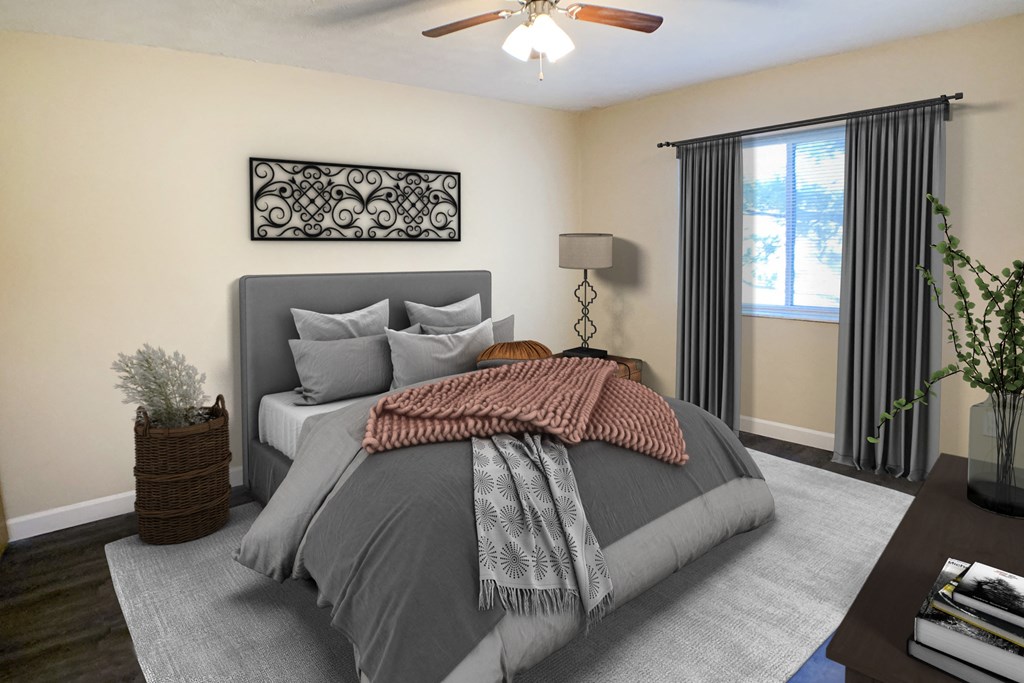 Quail Meadow Bedroom with ceiling fan and light at Quail Meadow Apartments, Ohio