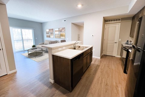 an open kitchen and living room with a couch at Brookfield Village in Grove City 43123