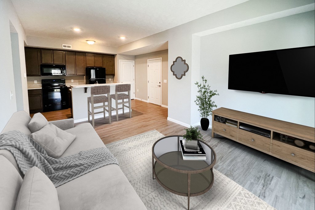a living room with a couch and a table at Brookfield Village in Grove City, OH
