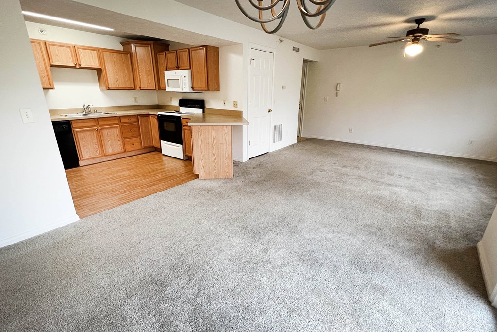 an empty living room and kitchen in a house  at Walton Ridge Apartments, Walton, KY, 41094