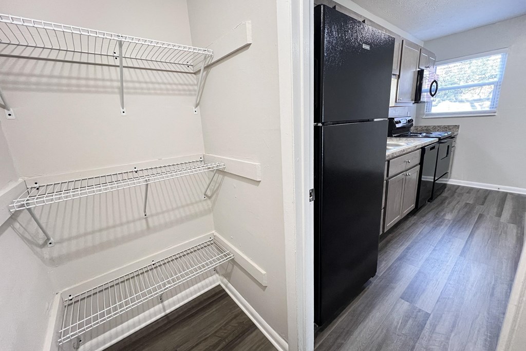 an empty kitchen with a refrigerator and a walk in closet at Revere Village Apartments, Centerville