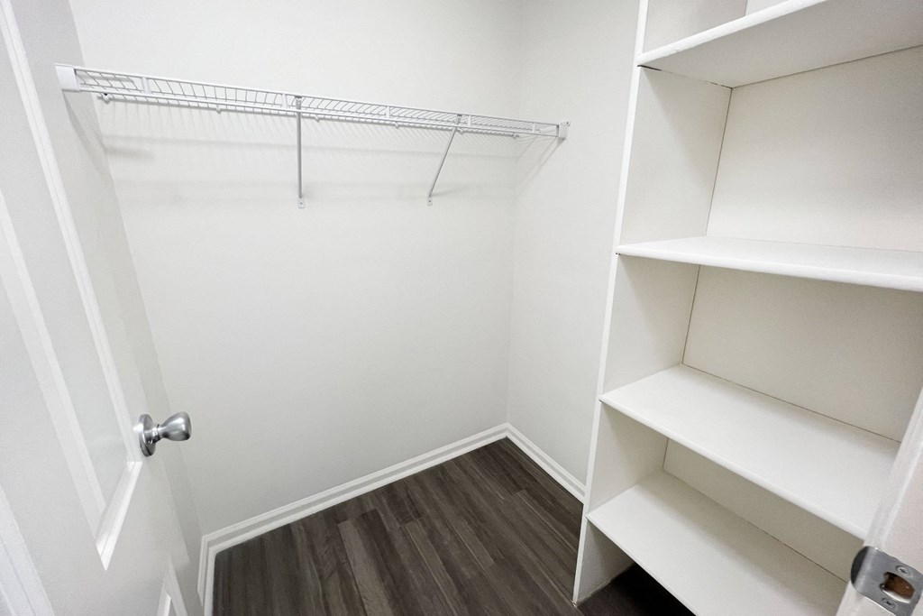 a closet in a small room with shelves and a door  at Deercross Apartments, Cincinnati, OH, 45236